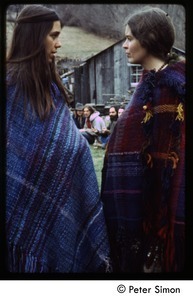 Two women wrapped in knit shawls, Tree Frog Farm Commune
