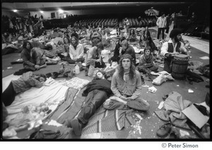 Resting and lying sleeping bags, on the floor of the Winterland Ballroom, at a Ram Dass gathering