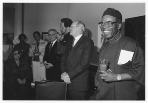 Chinua Achebe at reception with Joseph Duffey and others