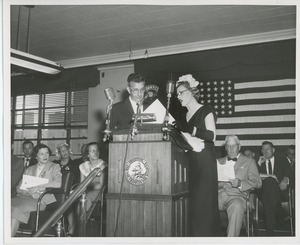 Helen Menken behind podium with unidentified man at Institute Day