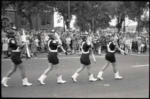 All-woman drill team in the parade for Robert F. Kennedy's visit, marching past the court house on10th Street during the Turkey Day parade
