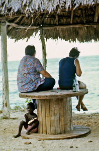 Two tourist women at beach in Haiti