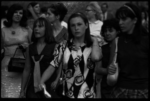 Beatles concert at Shea Stadium: close-up of Beatles fans, all girls, milling about the venue