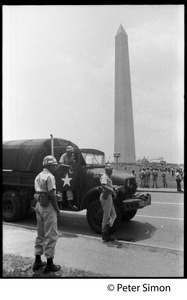 National guardsmen and truck at the ready during the March on the Pentagon (mobilization on Washington), the Washington Monument in the background