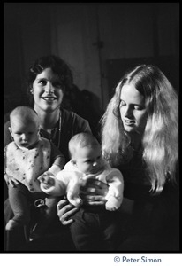 Cathy Brown (Usha, left) and another woman with babies, listening to Amazing Grace at the Energy Center