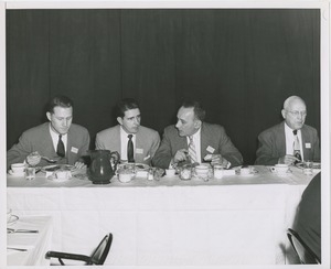 Group of men eating