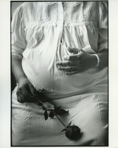 Pregnant woman with rose