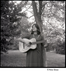 Lucy Simon playing guitar and singing
