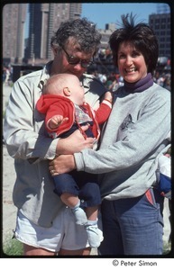 MUSE concert and rally: man and woman holding baby