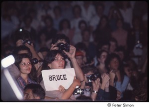 MUSE concert and rally: audience at the MUSE concert, woman holding sign reading, 'Bruce'
