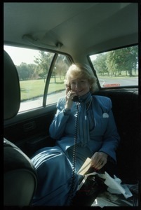 Margaret Heckler, United States Ambassador to Ireland, taking a phone call in the back of a limousine