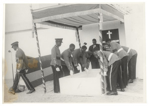 Officers of the Ghanian army lowering casket of W. E. B. Du Bois at his state funeral