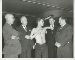 William Anderson demonstrates his arm prosthetics