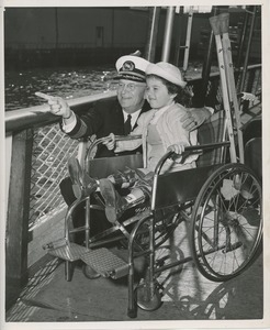 Child in wheelchair shown sights by captain