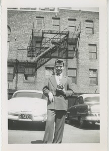 Unidentified young man with camera