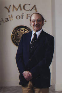 Thomas L. Bernard in front of the YMCA Hall of Fame Sign, ca. 2011