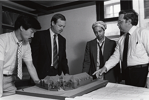 Brien D. Wong, John Lyons, Khadijah Abdus-Sabur and Public Facilities Director Len Jones looking at model of police station at corner of Morton Street and Blue Hill Avenue