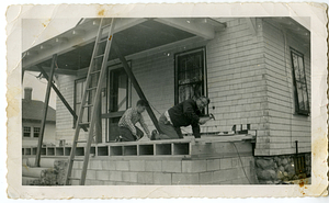 Robert and Tebert Mello, working on house