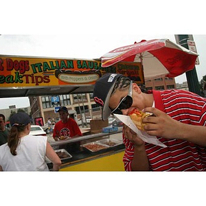 Danny Vazquez enjoys a sandwich outside Fenway Park