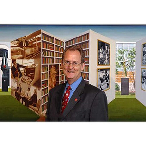 William Bartolini in front of 3D artwork in the Student Center