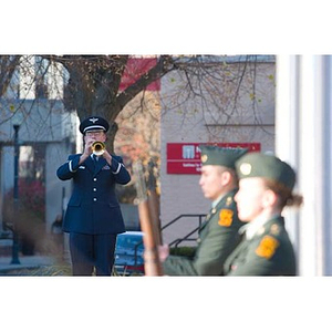 A man plays trumpet at the Veterans Memorial dedication ceremony