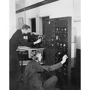 Two Electrical Engineering students experimenting in laboratory