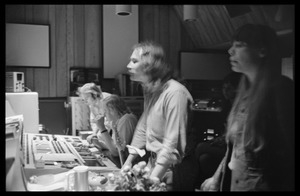 In the control room at Wally Heider Studio 3 during production of the first Crosby, Stills, and Nash album: (l. to r.) Stephen Stills and Bill Halverson at the mixing board, David Crosby and Joni Mitchell