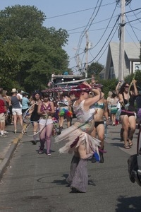 Parade marchers wielding hula hoops : Provincetown Carnival parade
