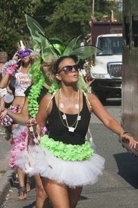 Parade marchers with green fairy wings and tutus : Provincetown Carnival parade