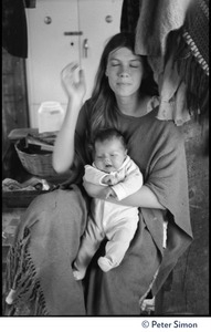 Woman holding an infant, Lama Foundation