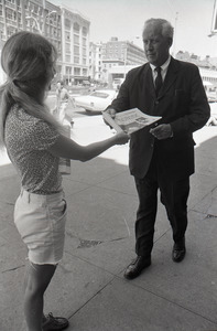 Boston Phoenix promotional photos: Phoenix hawker handing paper to man