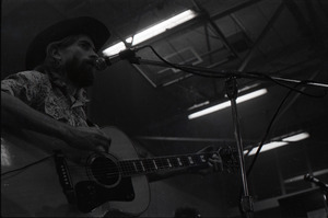 New Riders of the Purple Sage opening for the Grateful Dead at Sargent Gym, Boston University: John 'Marmaduke' Dawson playing acoustic guitar and signing