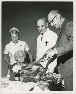 Dr. DiMichael carving turkey