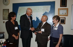 Congressman John W. Olver presenting Outstanding Older Worker award to Robert Grenier at Experience Works