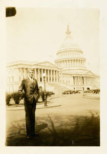 Leon M. Smith standing in front of Washington D.C.'s capital