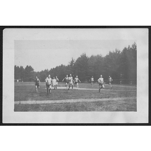 View of campers running across a field