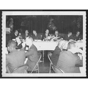 Adults seated at tables at a banquet