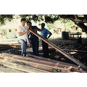 Men inspecting lumber