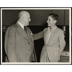 J. Willard Hayden, at left, talks to Roberto Paulo Cezar De Andrade of Brazil at the dedication and cornerstone laying ceremony for the Charles Hayden Memorial Clubhouse in South Boston