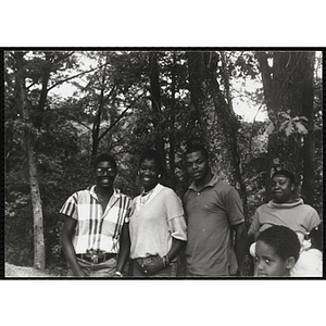 A Group of youth standing in the woods