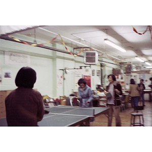 Players at Chinese Progressive Association International Women's Day ping-pong tournament