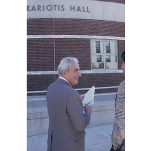 George S. Kariotis walking toward Kariotis Hall