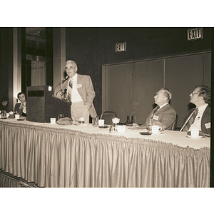 Secretary of Development for the Commonwealth, George Kariotis, E'1944, speaking from the podium at a campus event