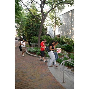 Four students walk into the Student Center during the Torch Scholars Scavenger Hunt