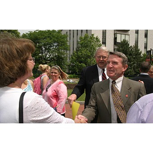 General Richard Neal shakes hands with a woman at the Veterans Memorial groundbreaking ceremony