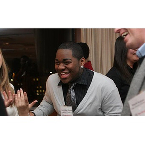 Ulysses Ifill laughs at a Torch Scholars event