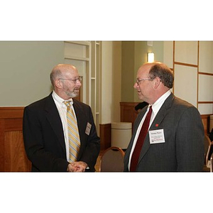 Two men converse at the Training Future Innovators Entrepreneurs Panel