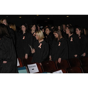 Students stand at School of Nursing convocation