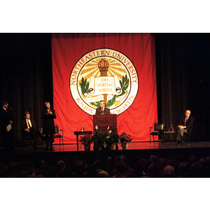 Lech Walesa stands at the podium to inaugurate the International Degree Program
