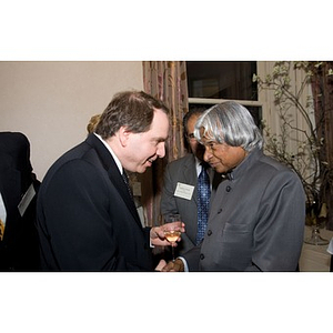 Dr. A. P. J. Abdul Kalam speaking with a guest at a party